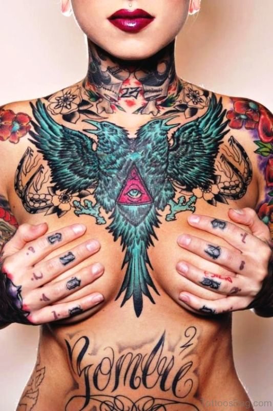 Two Faced Blue Bird Tattoo On Chest 