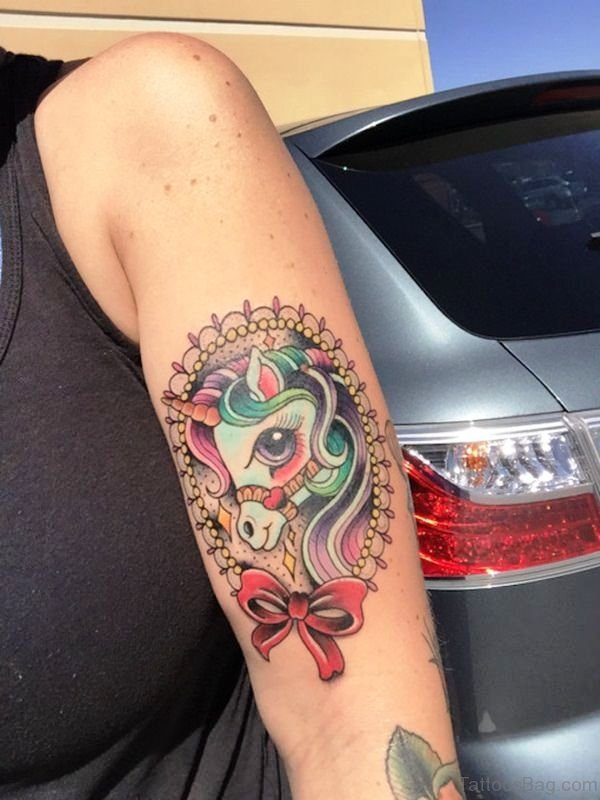 Unicorn With Red Ribbon Tattoo Design