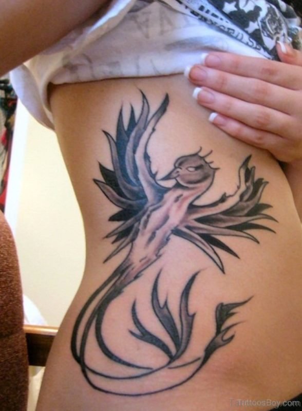 Unique Phoenix Tattoo On Rib 