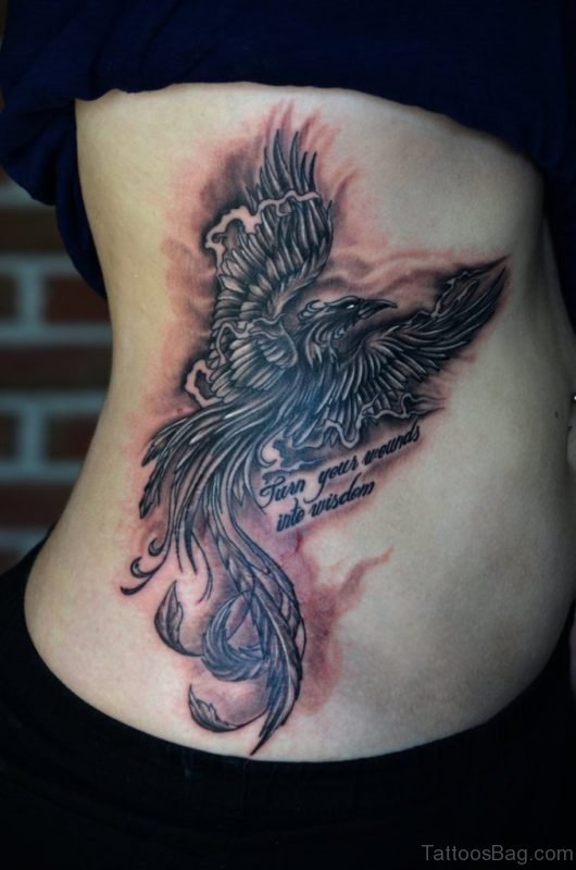 Wording And Phoenix Tattoo On Rib 