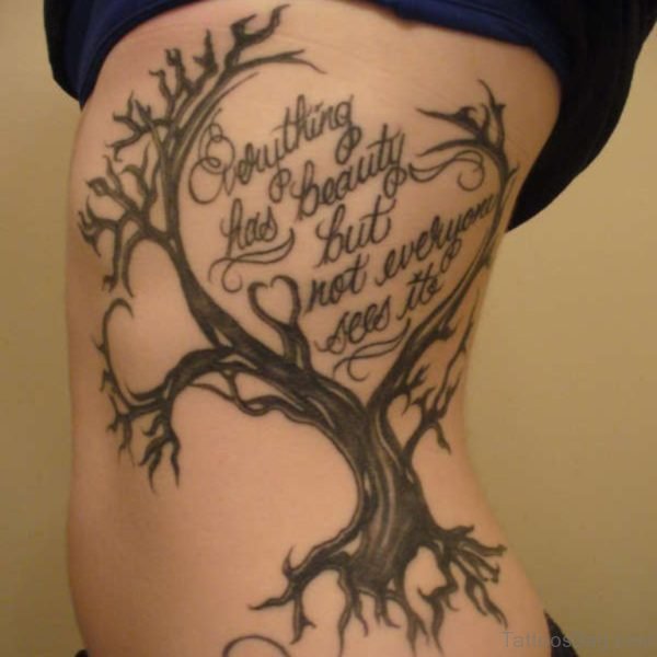 Wording And Tree Tattoo On Rib