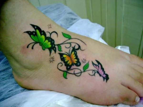 butterfly and stars tattoo on foot
