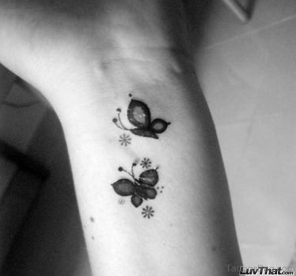 Black ANd White Butterfly Tattoo On Wrist