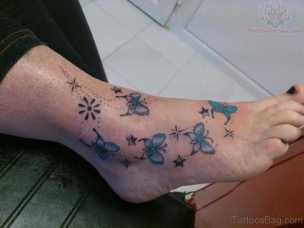 Blue Butterfly And Star Tattoo On Feet