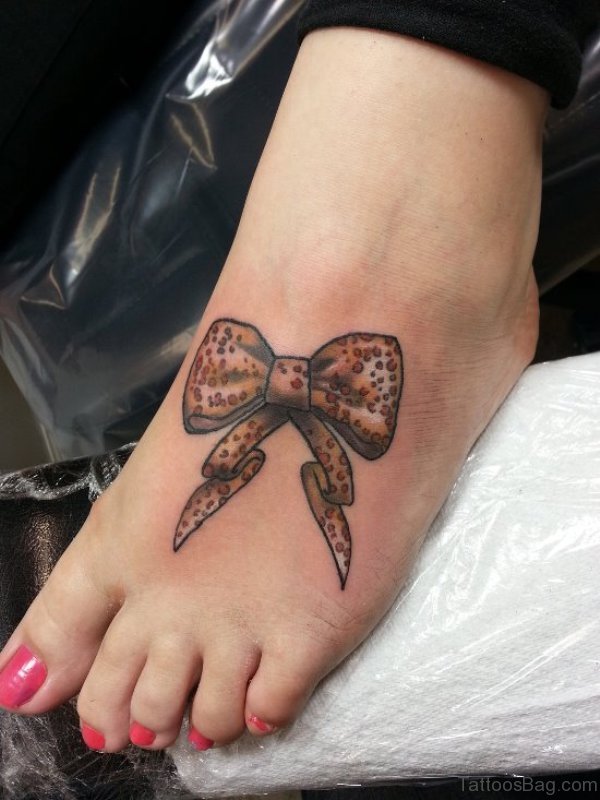 Brown Bow Tattoo On Foot