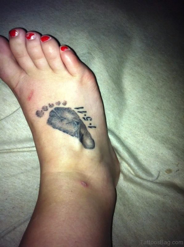 Grey Baby Footprint Tattoo On Foot