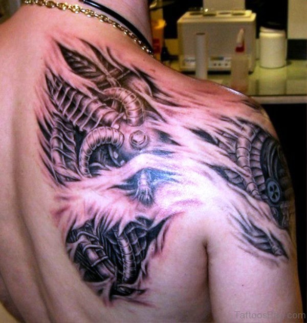 Grey Inked Anatomical Tattoo On Shoulder