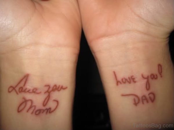 Lettering Brown Tattoo On Wrist