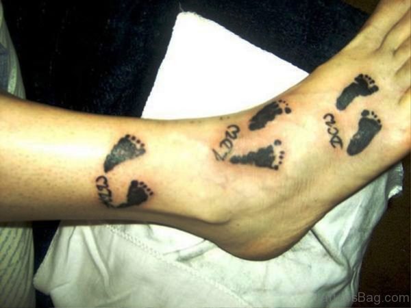 Lovely Baby Footprints Tattoo Design