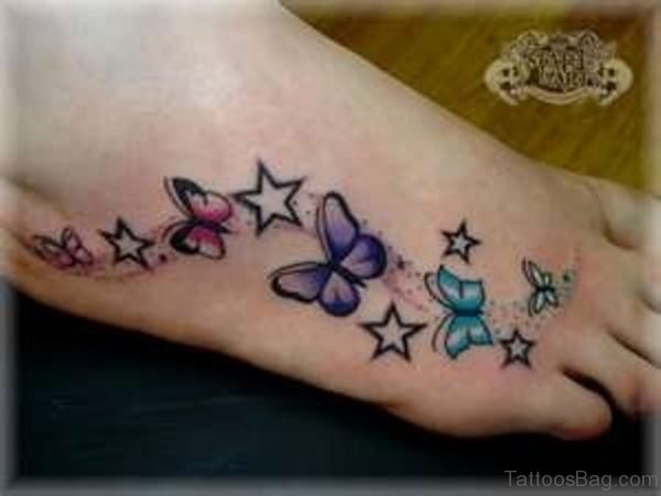 Nice Butterfly And Star Tattoo On Feet