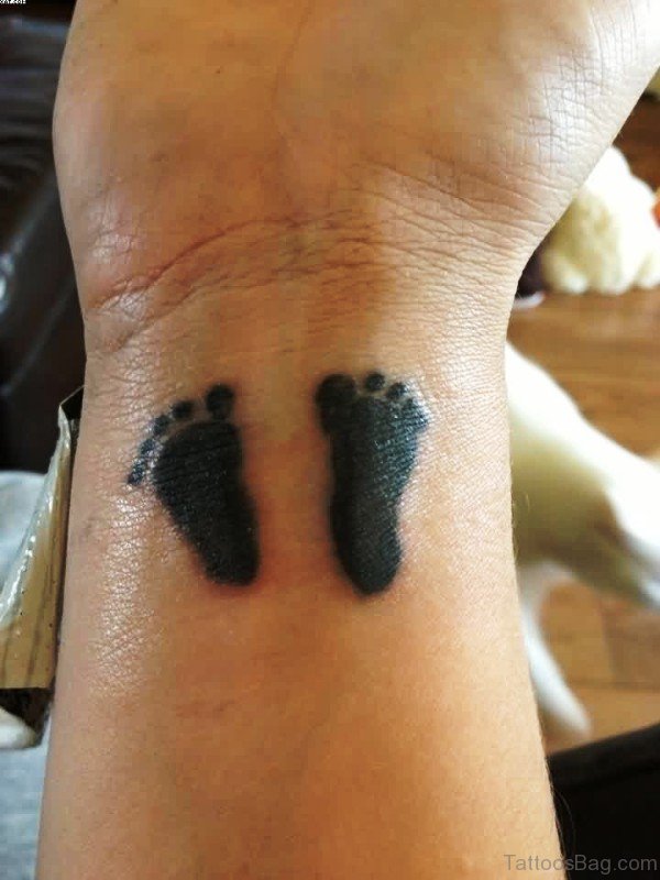 Sweet Baby Footprints Tattoo On Wrist