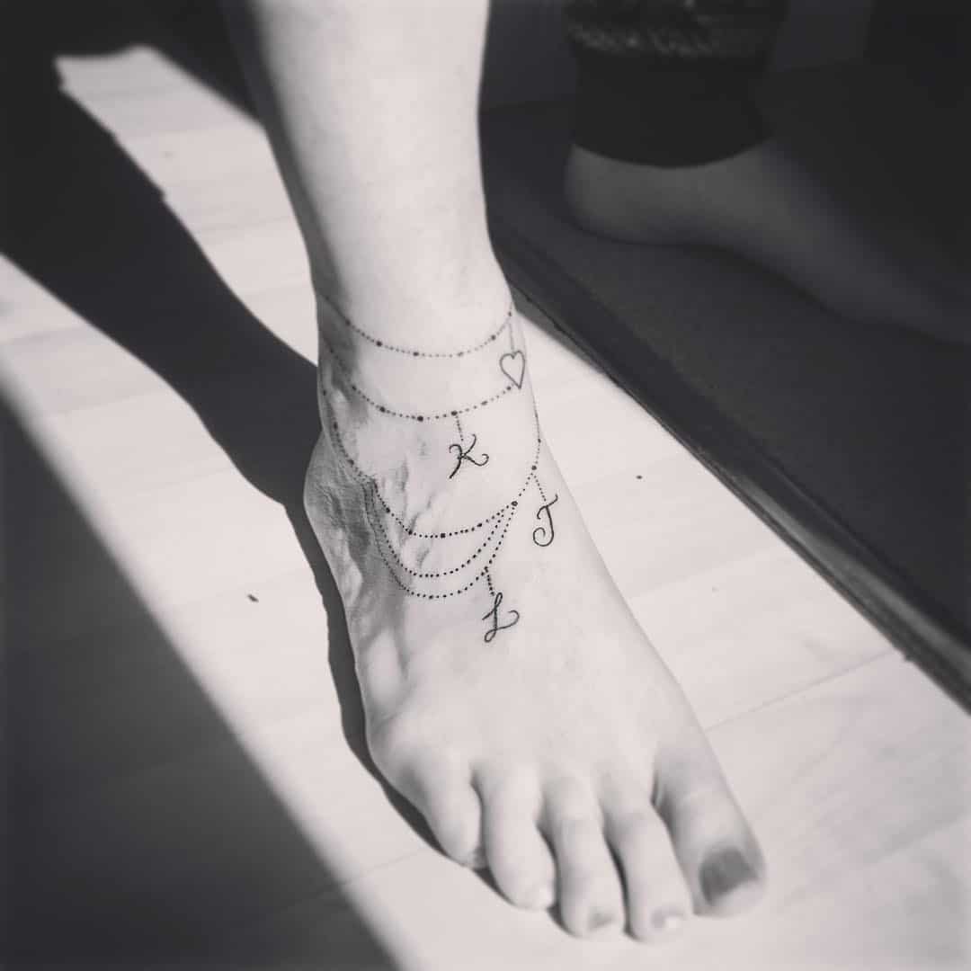 Ankle Bracelet Tattoo With Name Initials.