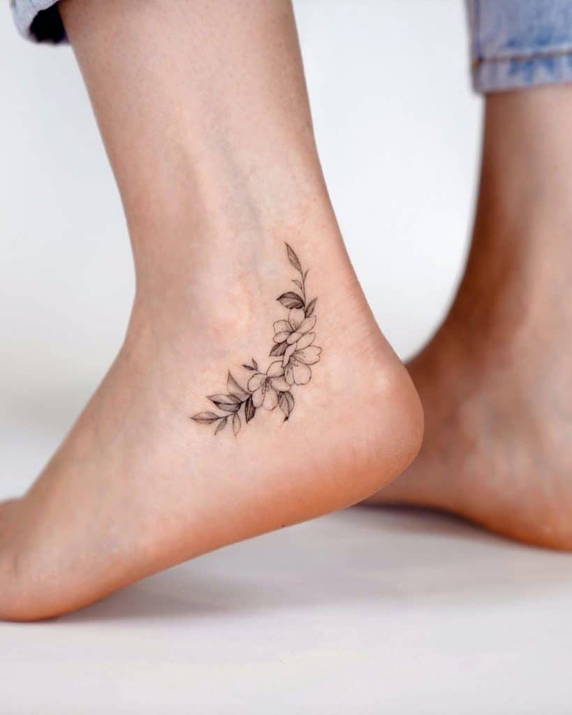 Small Black White Flower Ankle Tattoo 819x1024 1