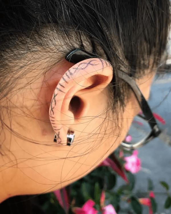Difrent Lines Tattoo On Ear